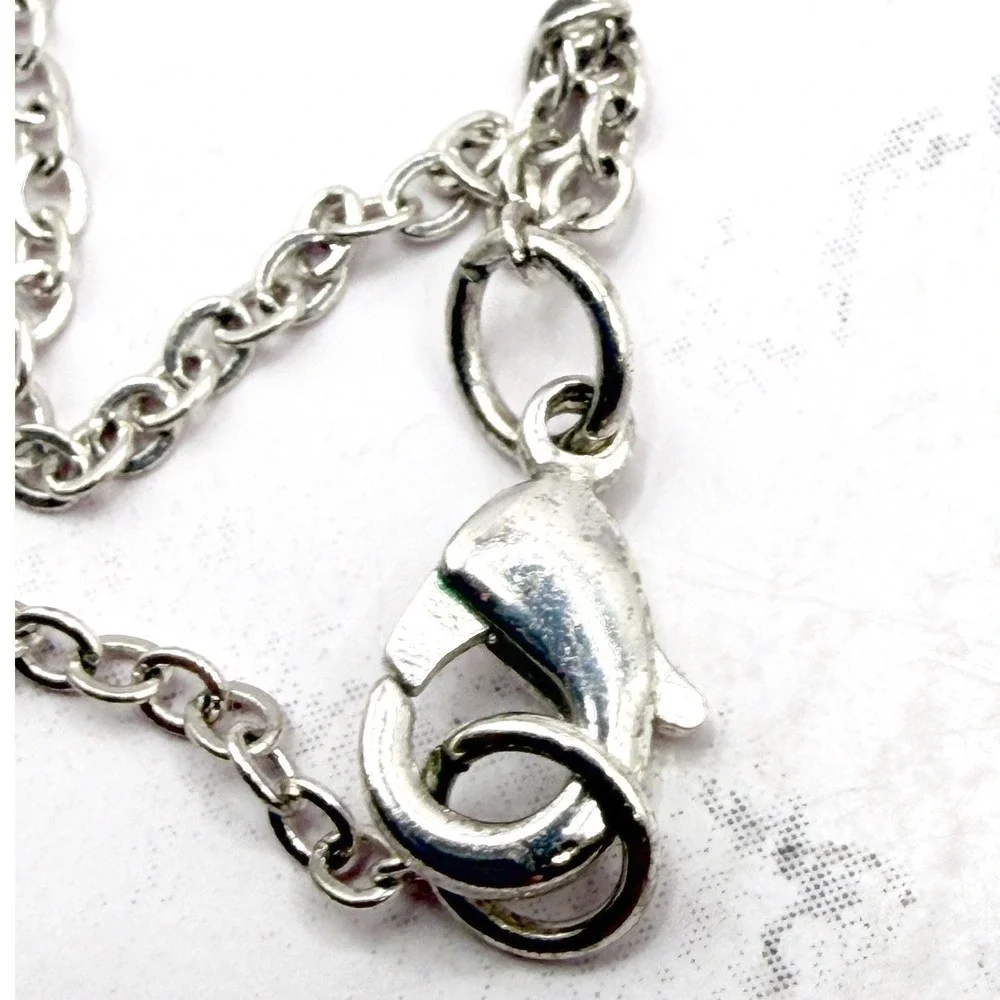 Source Unknown long silver